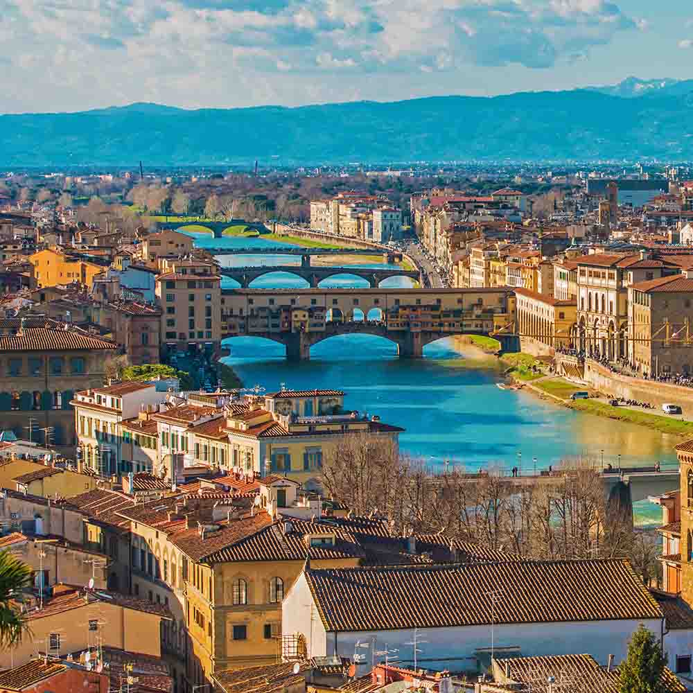 Top view of an Italian city with bridges and river