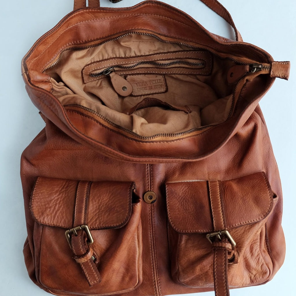 A photo showing the Liam backpack in natural leather