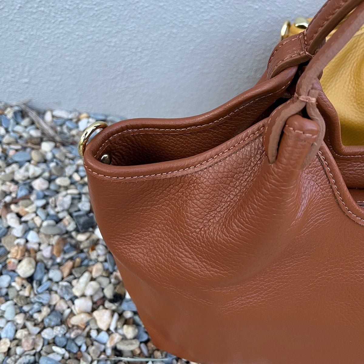Close up view of the Adriane tote in peru or tan