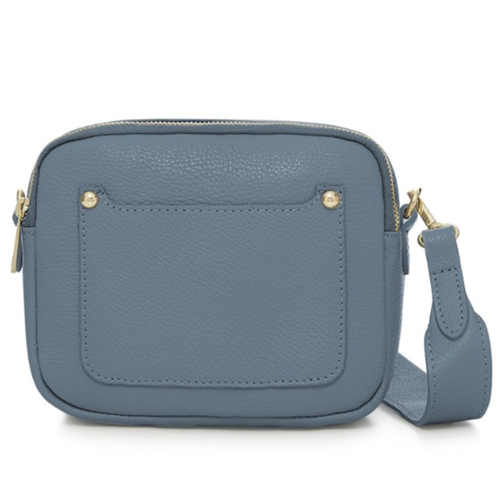 Blue crossbody bag with gold zippers on a white background
