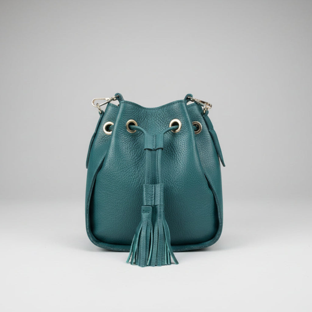 Green bucket style handbag with tassels