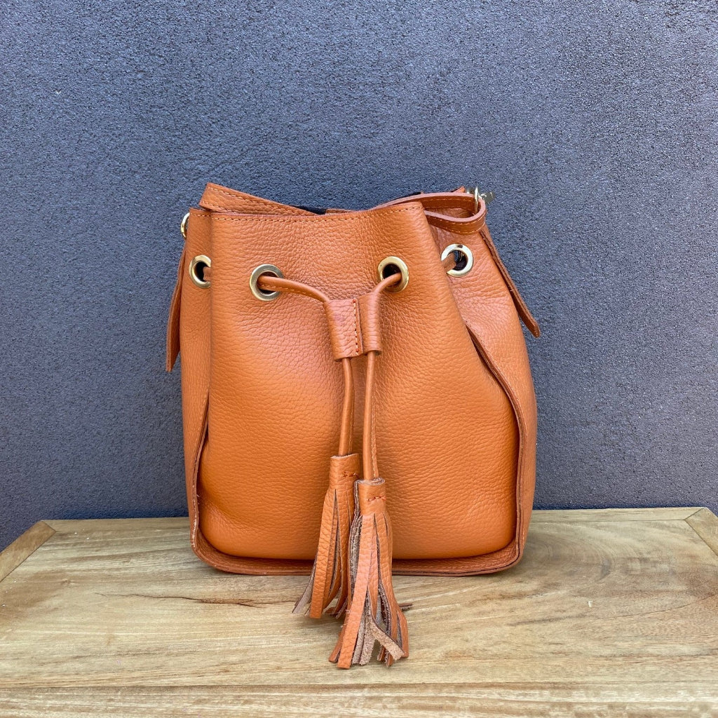 Tan/orange leather bag with tassels