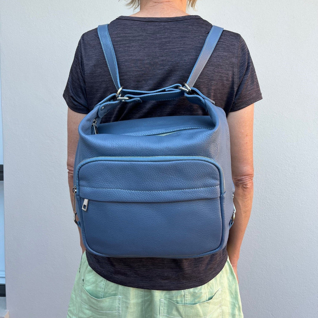 Sorella Handbags Person wearing a blue Phillipa bag as a backpack