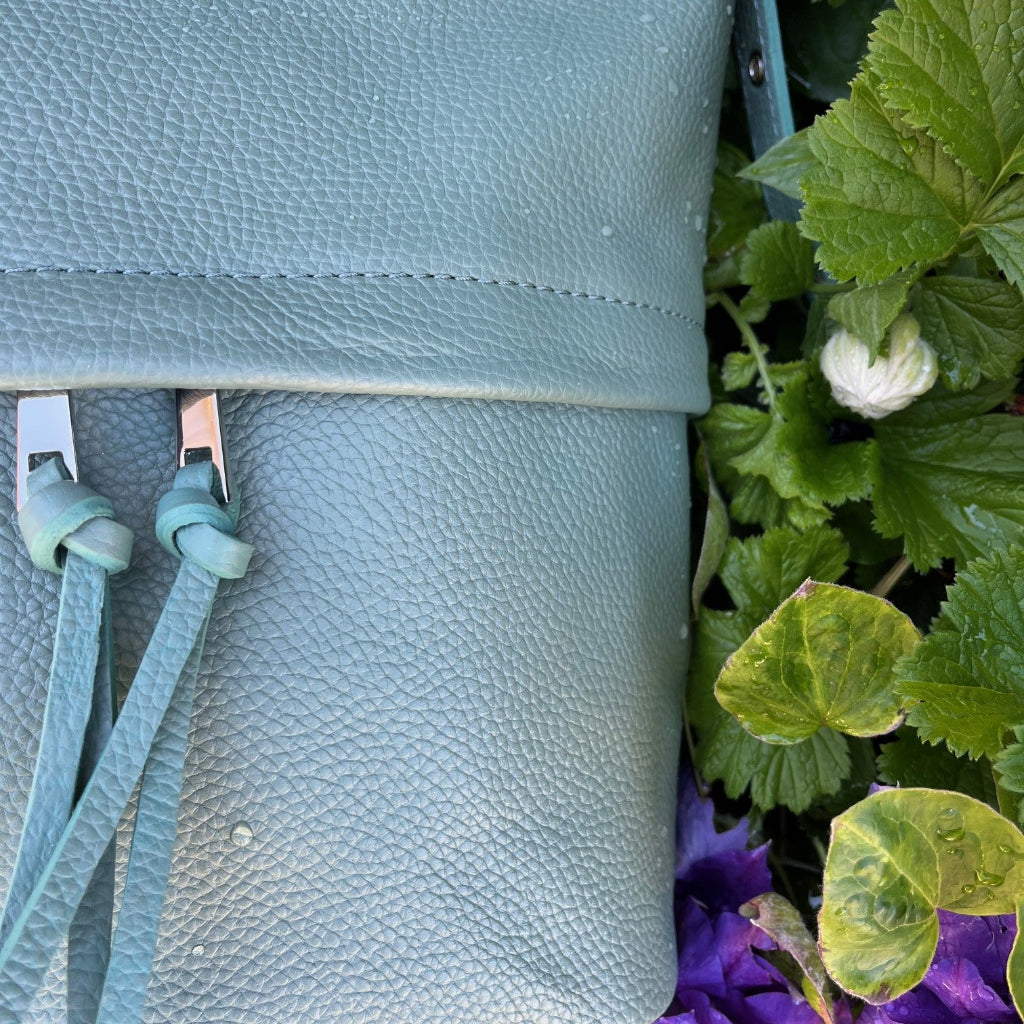Close up view of the Tilly bag in sage green