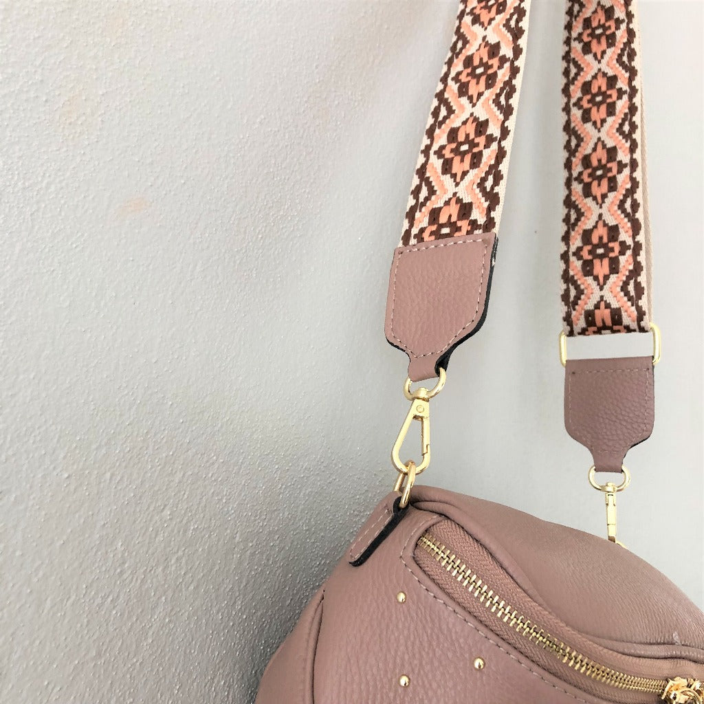 photo of the destiny bag in nude pink showing strap