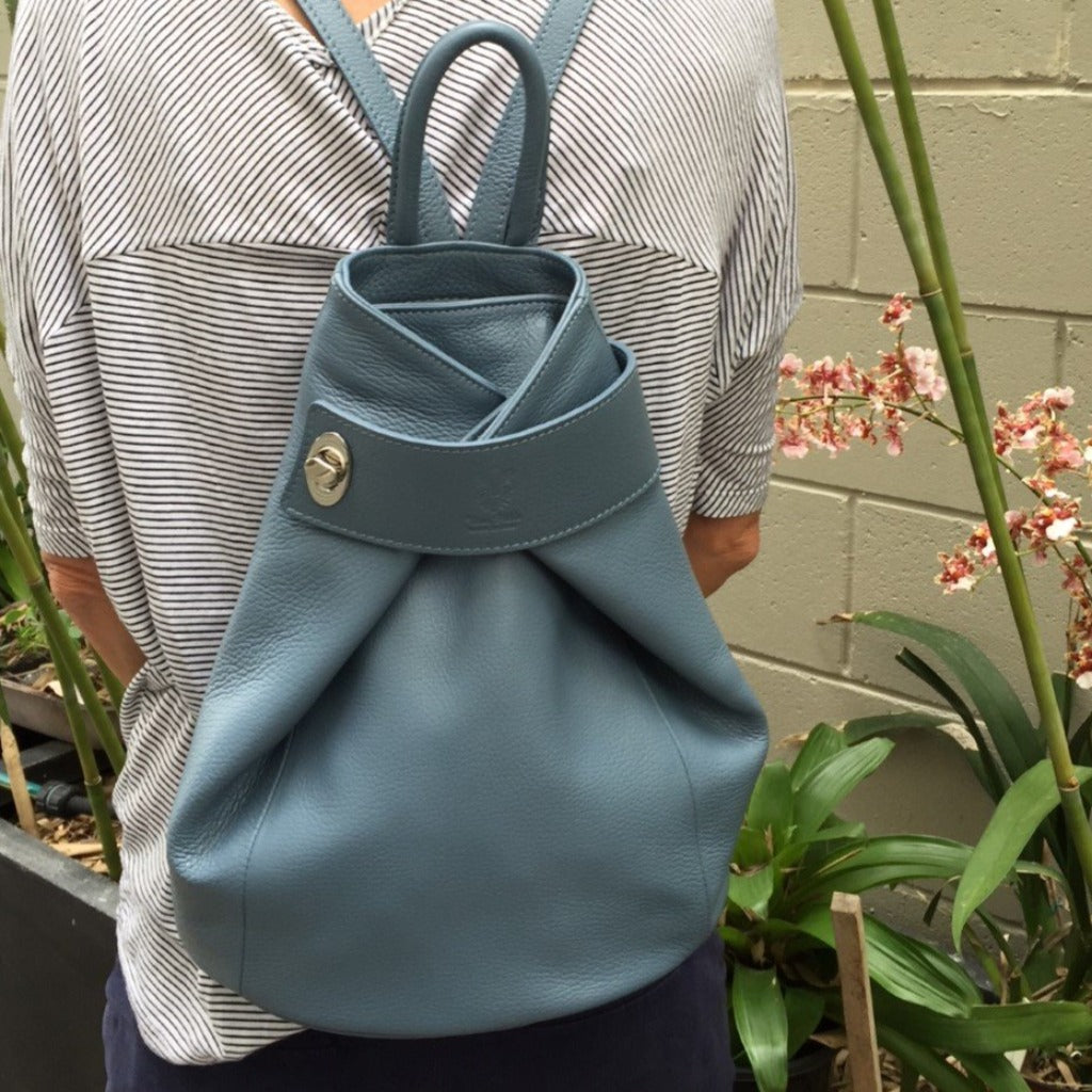 Woman wearing the Pavlova backpack in denim blue