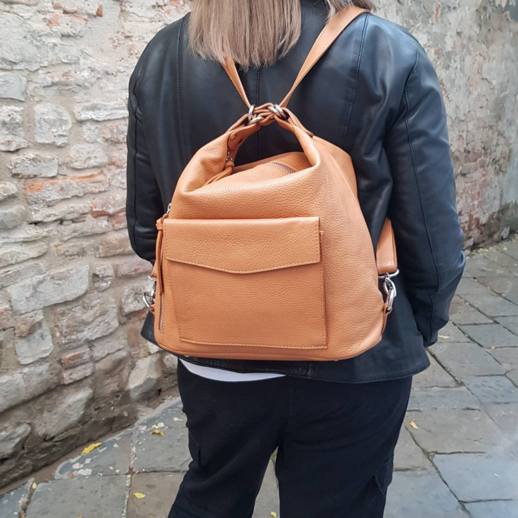 Woman wearing the Phillipa bag in tan