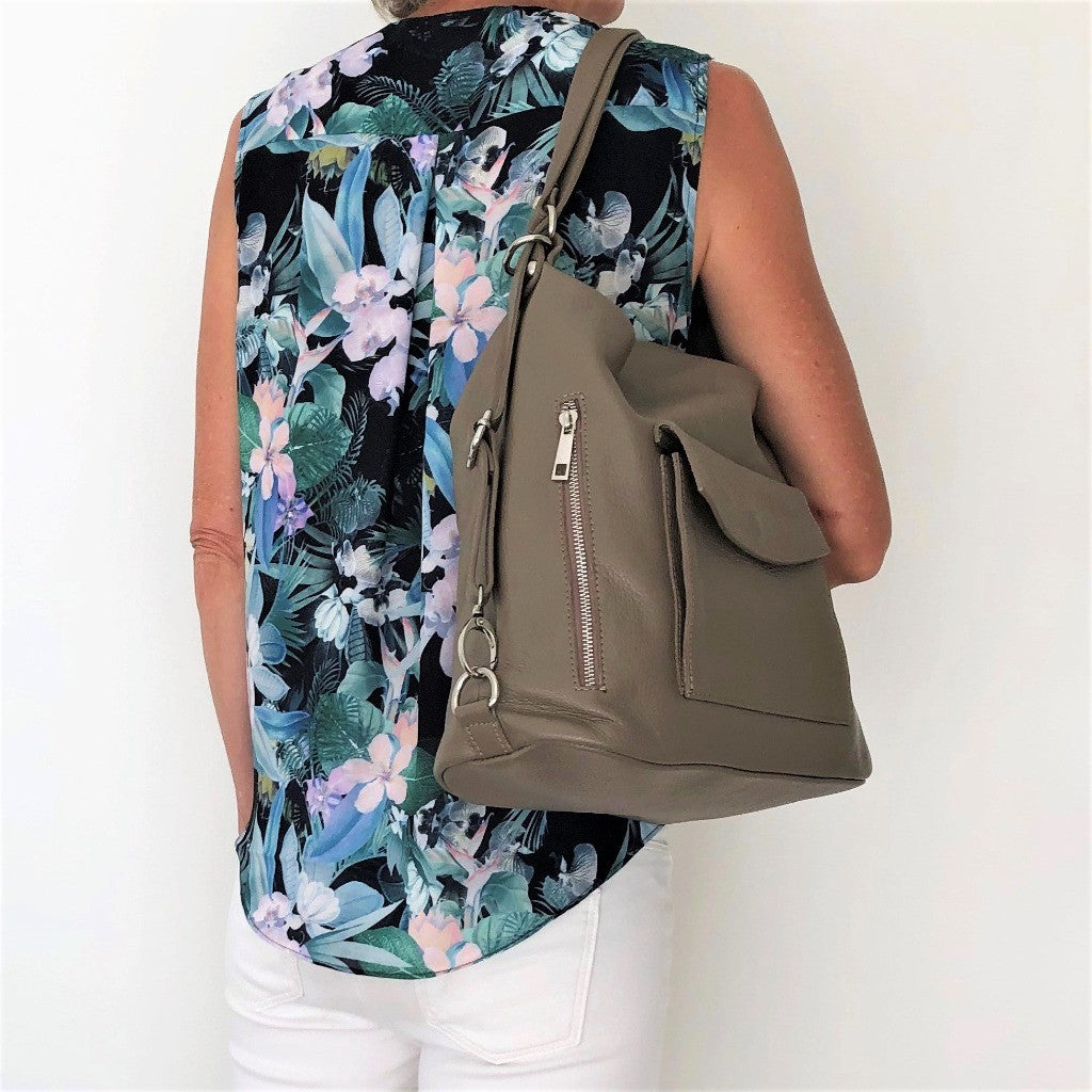 Woman with the taupe Phillipa bag over her shoulder