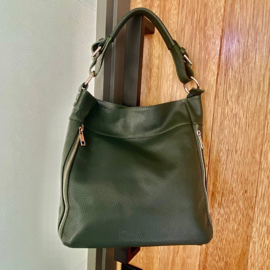 Woman holding the Samantha bag in denim
