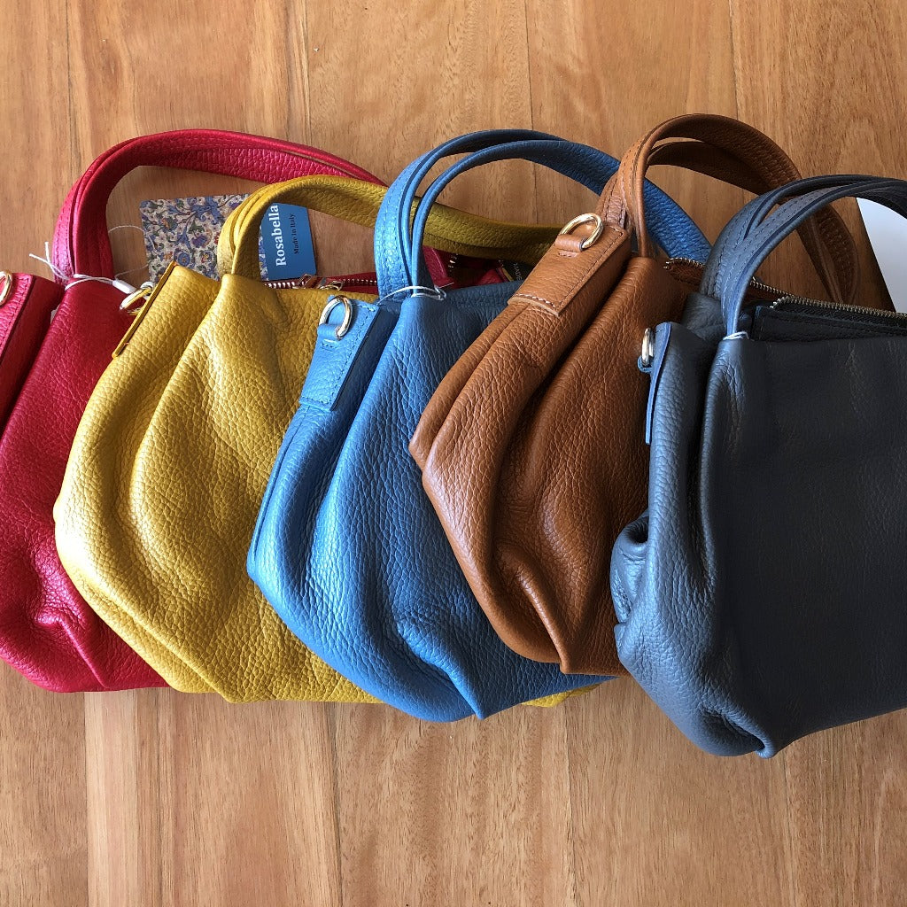 A photo showing a group of Paris bags lying flat on the floor