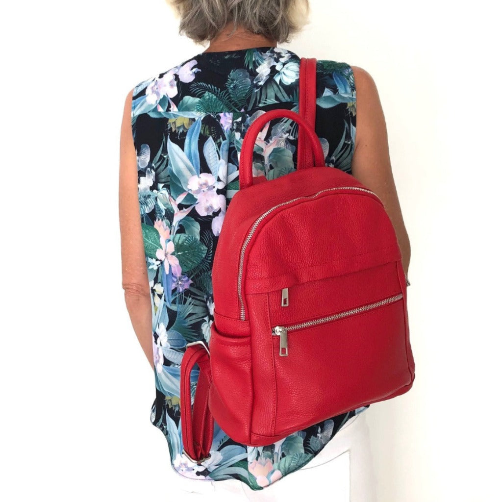 Woman with the Ally backpack in red