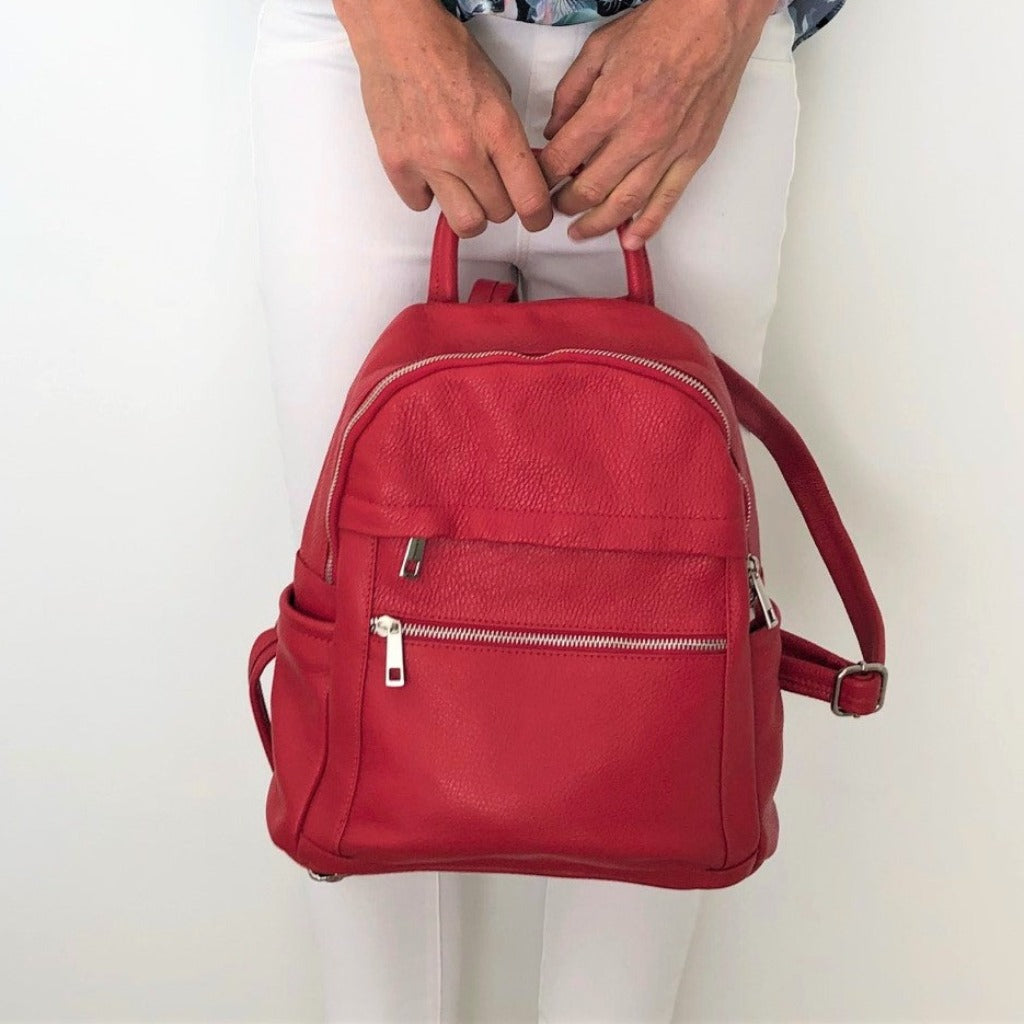 Woman with the Ally backpack in red