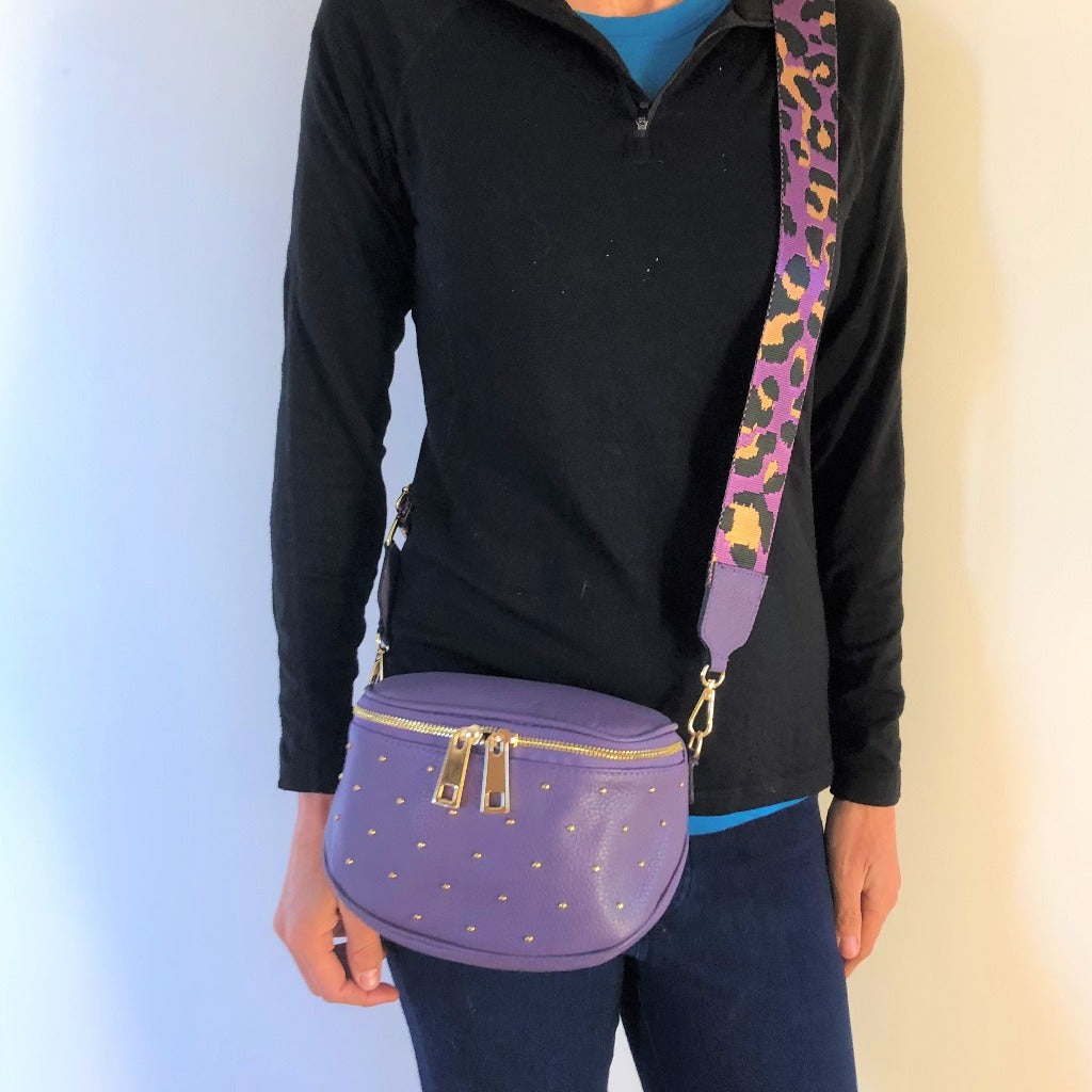 Woman wearing the purple destiny bag