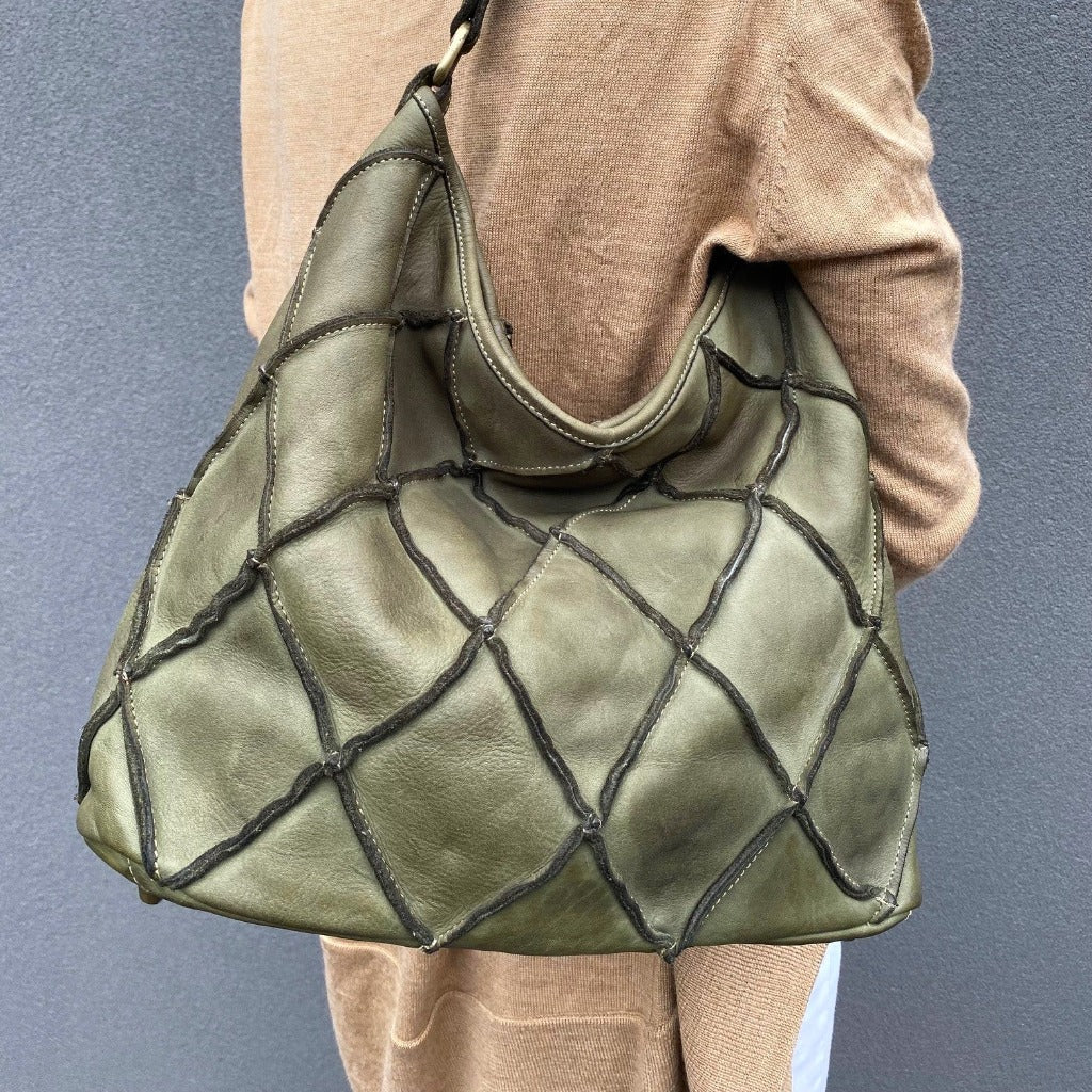 Woman wearing the Clarissa bag over her shoulder