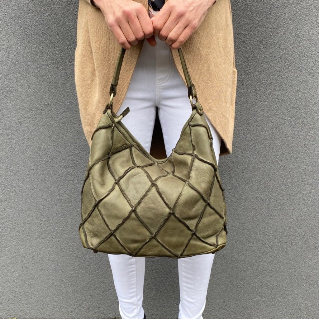 Woman holding the Clarissa bag