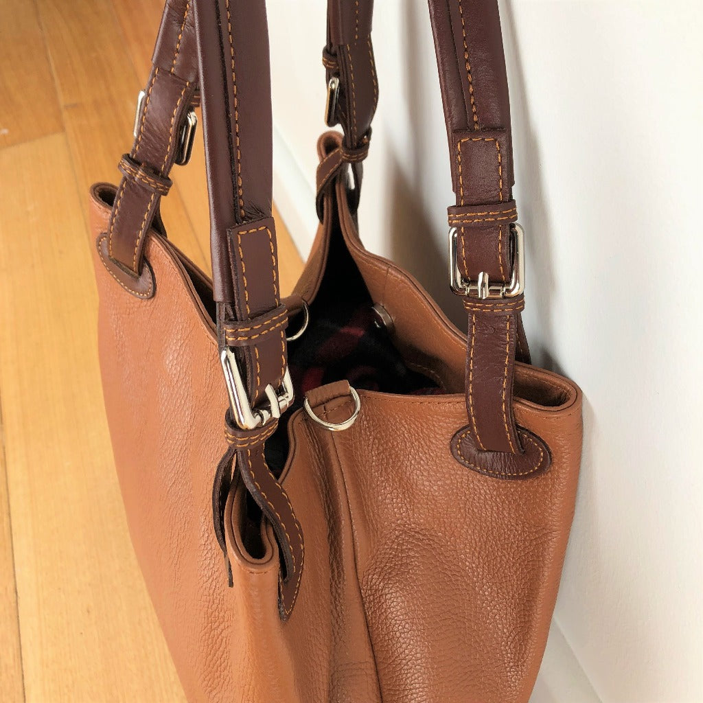 Side view of the Dawn bag in tan or cognac