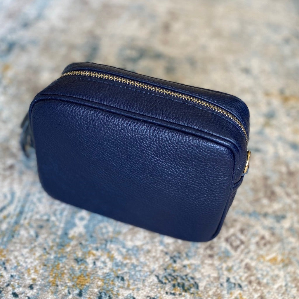 Navy Ella bag on a rug