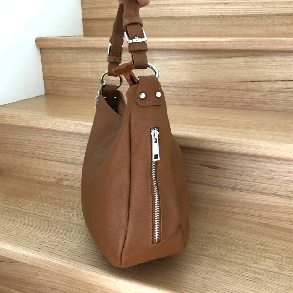 Side view of the Elsa bag in dark tan