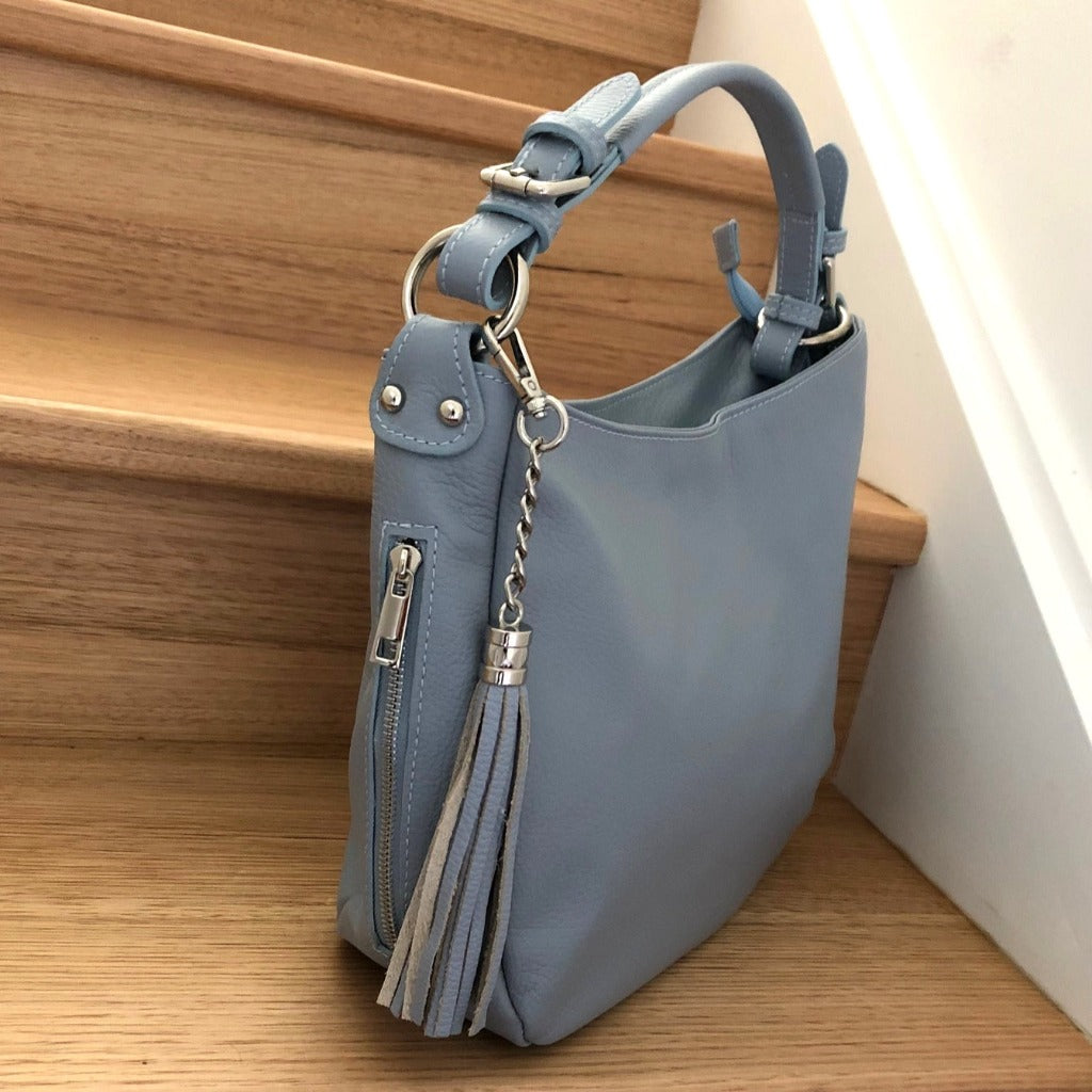 Side view of the Elsa bag in slight blue