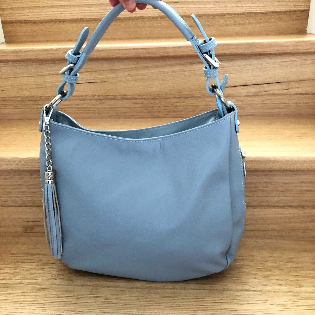 Elsa bag in light blue on stairs