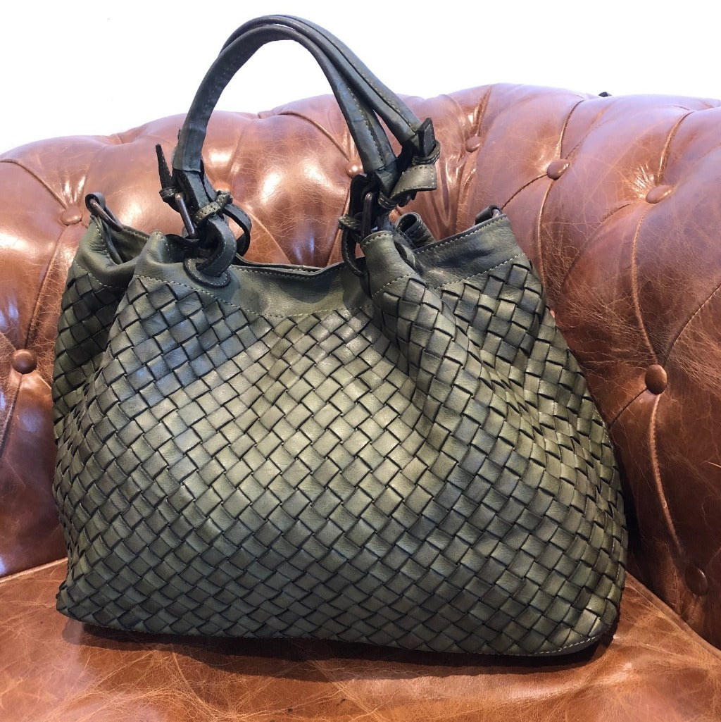 Diamonte bag in olive green on a couch