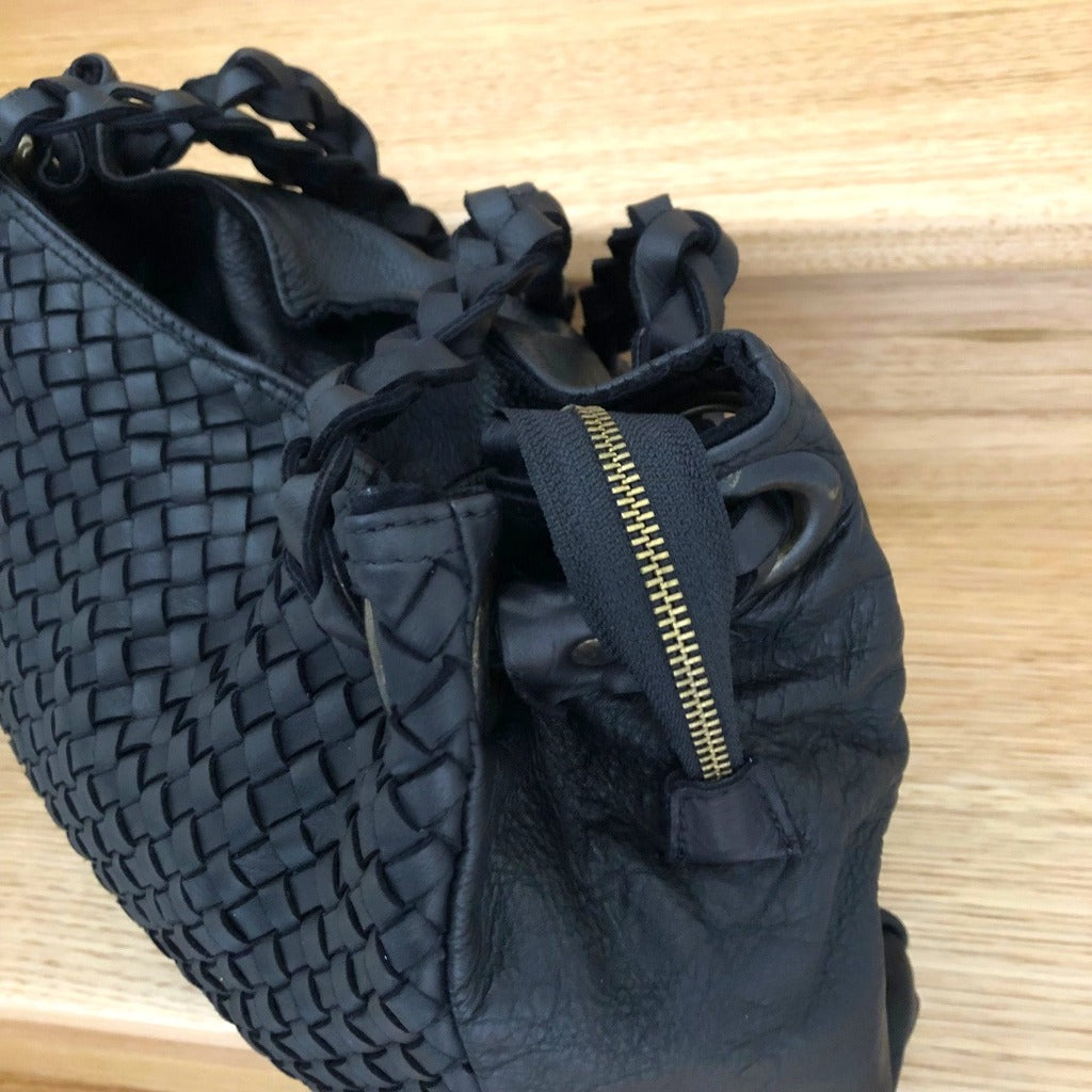 Close up view of the Izzy bag in black