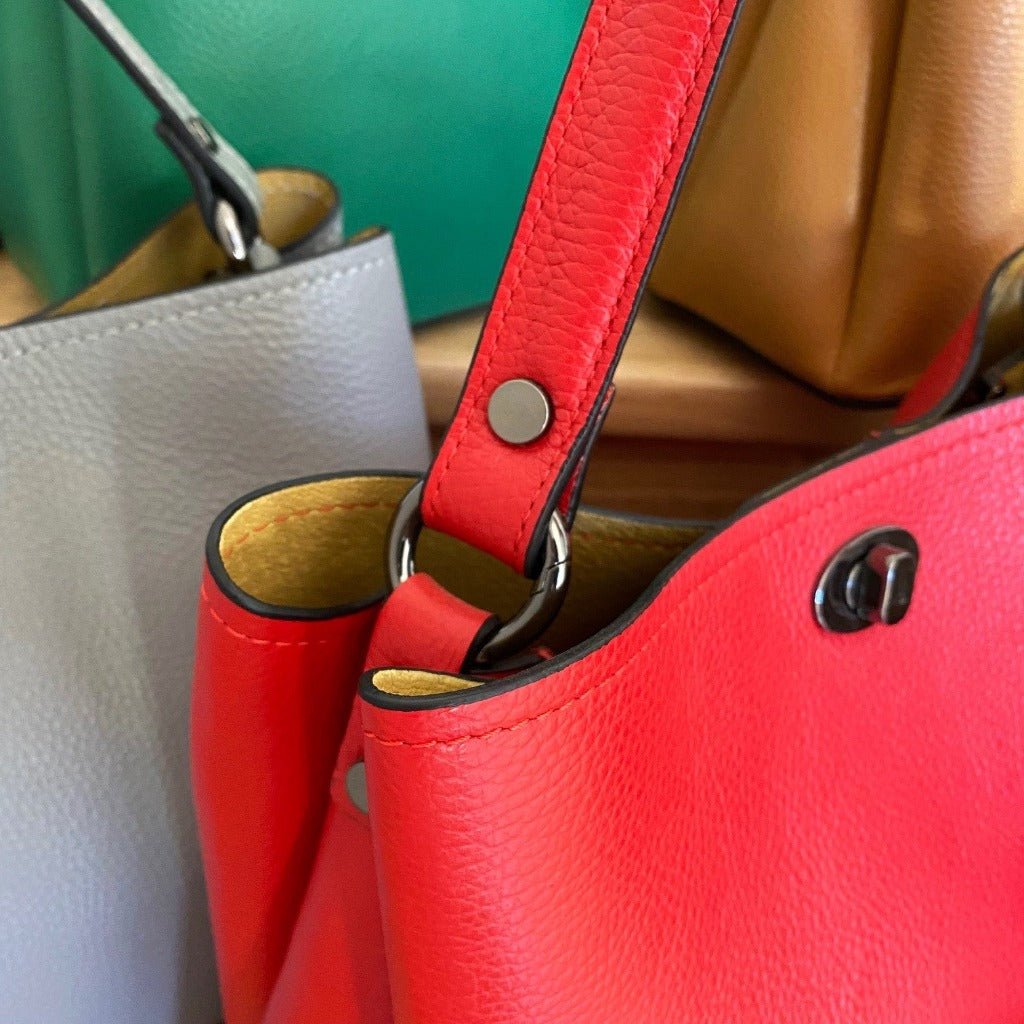 Close up photo of the Maggie bag in red