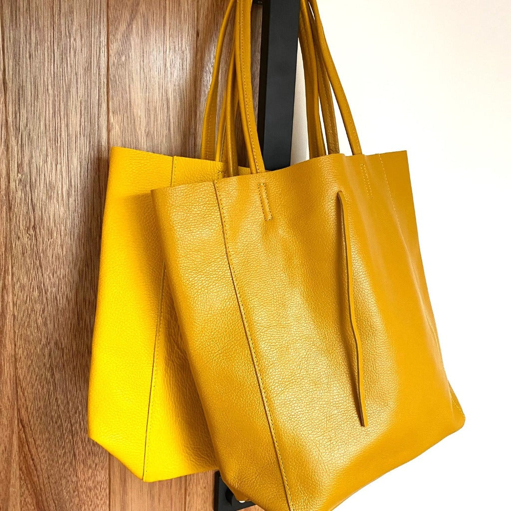 Muzi bag in yellow (left) and mustard yellow (also known as gold)