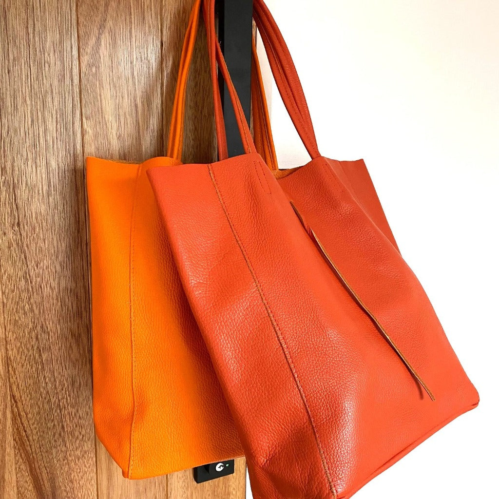 Muzi bag in orange(left) and burnt orange (also known as red orange)