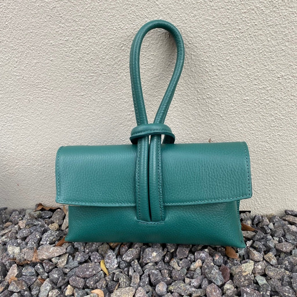 Rachelle clutch in sea green taken outside