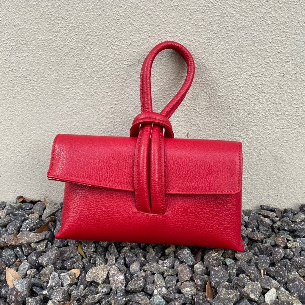 Rachelle clutch in red taken in natural light