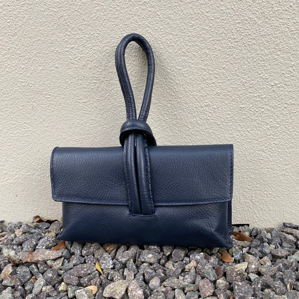 Rachelle clutch in navy taken outside