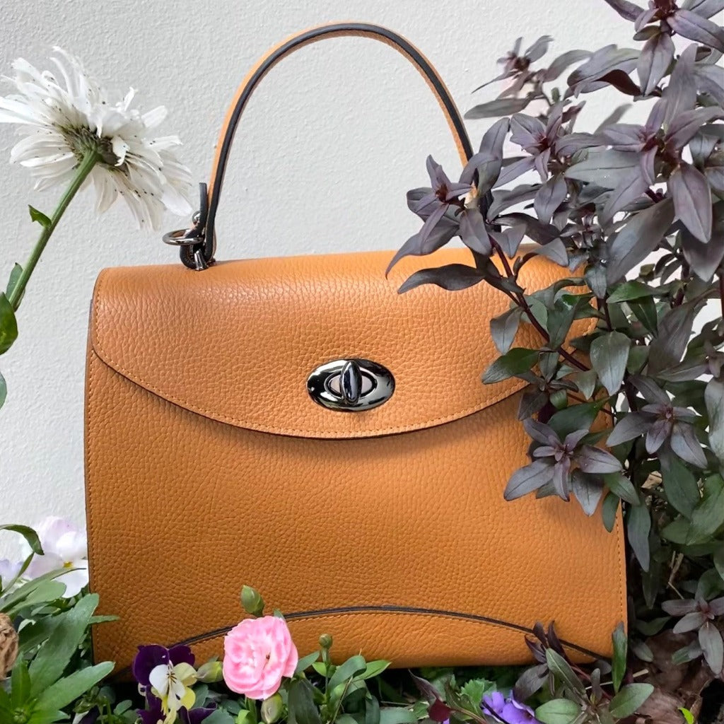 Rita bag in peru amongst flowers