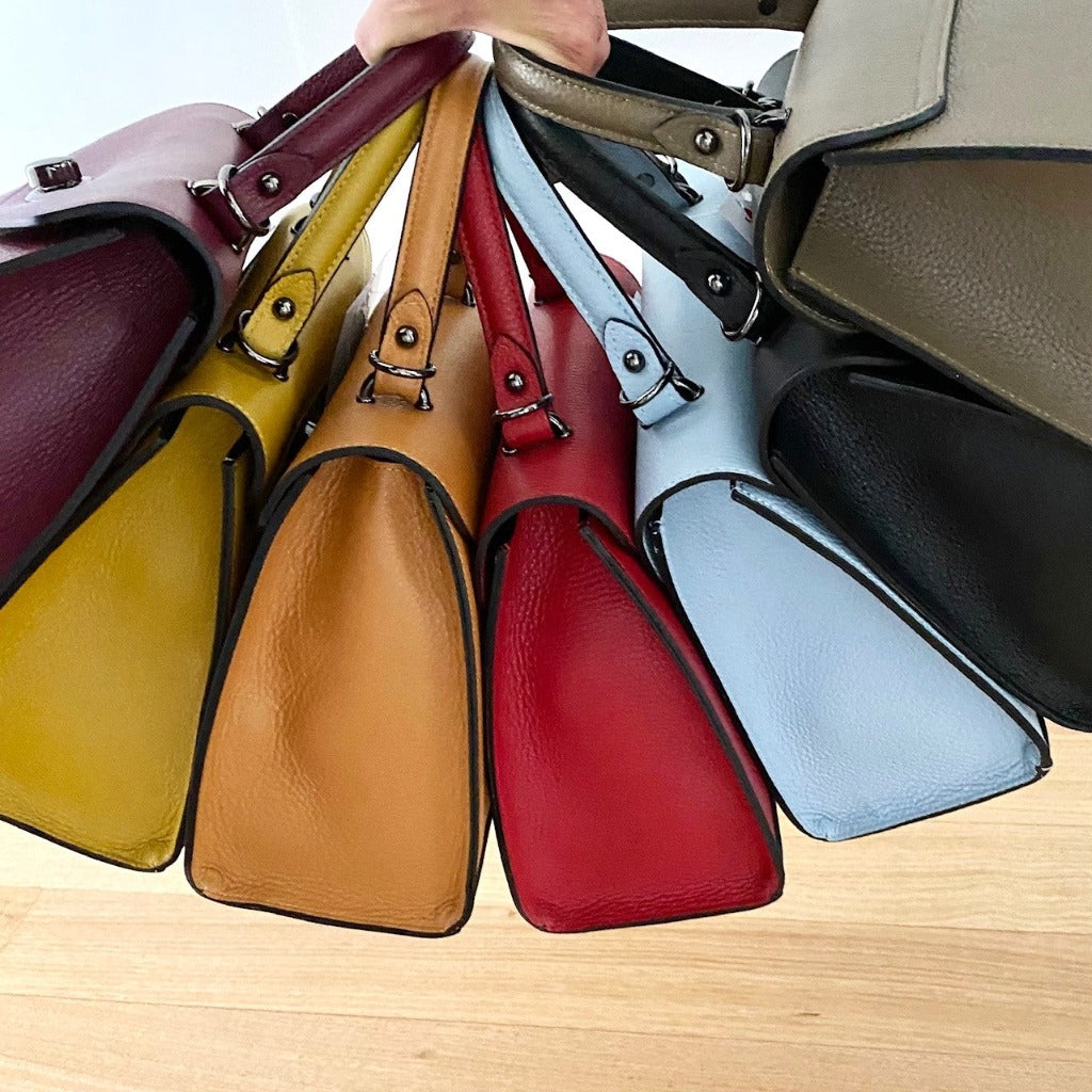 Side view of the Rita bag in multiple colours