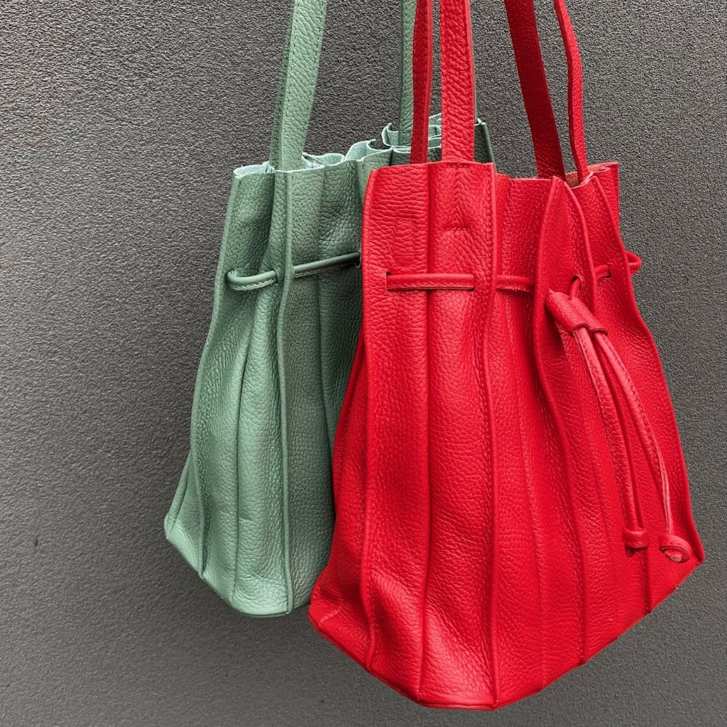 Another photo showing the Susie bag in sage green and red