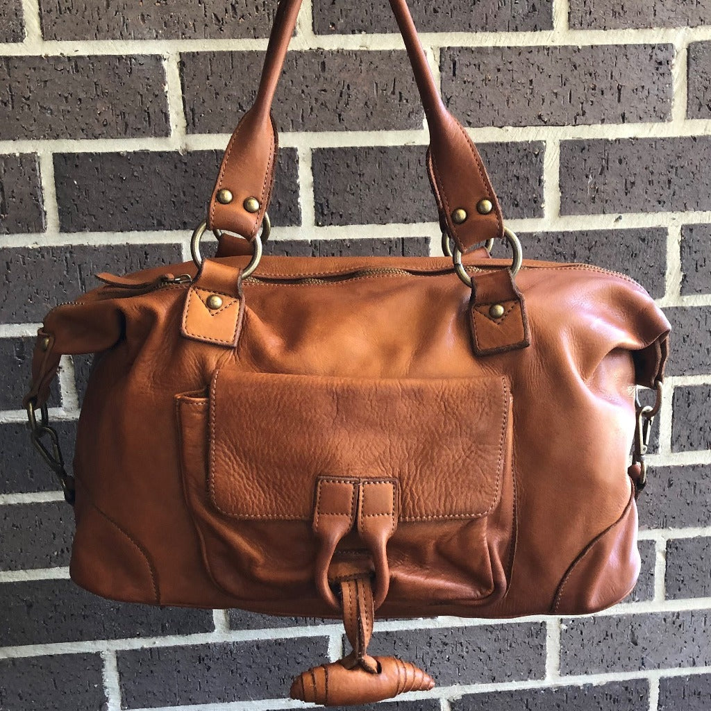 Tori vintage bag against a wall