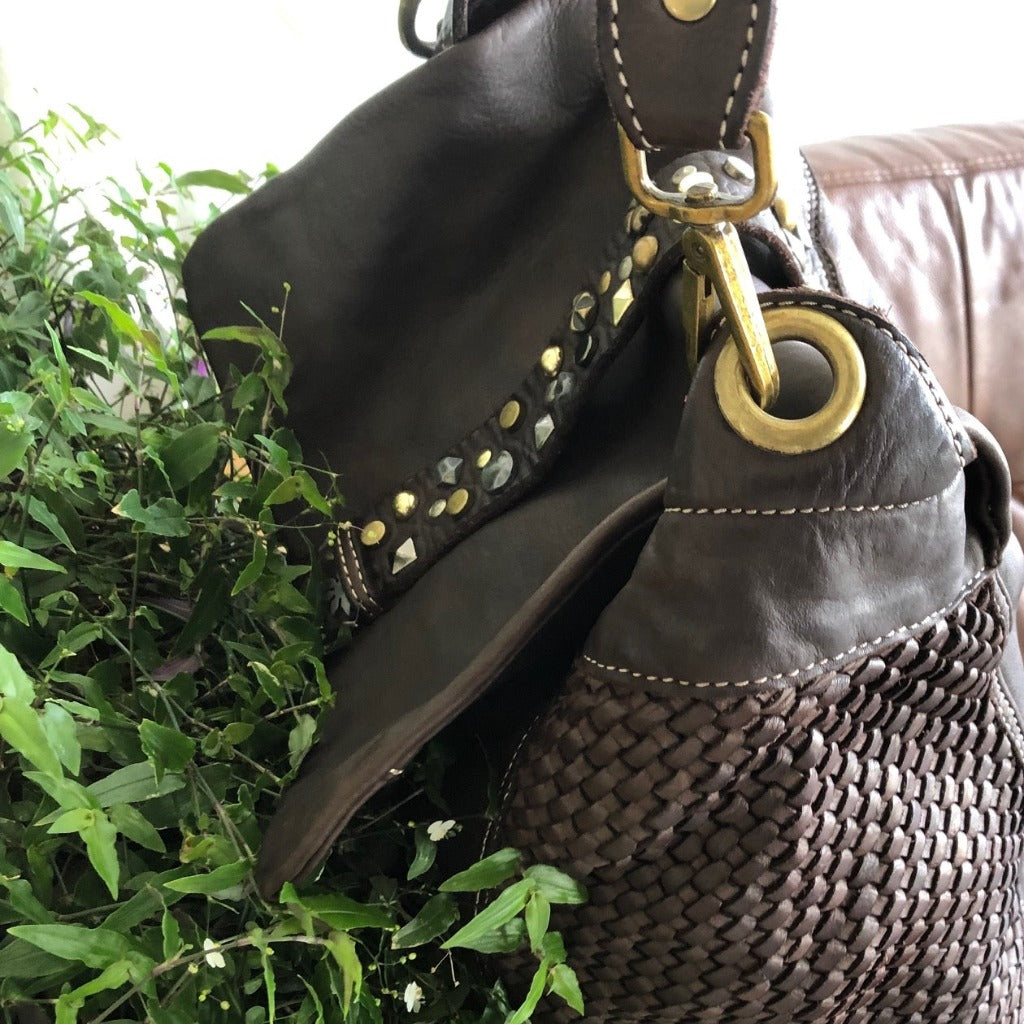 Close up view of the Veriga bag in dark brown