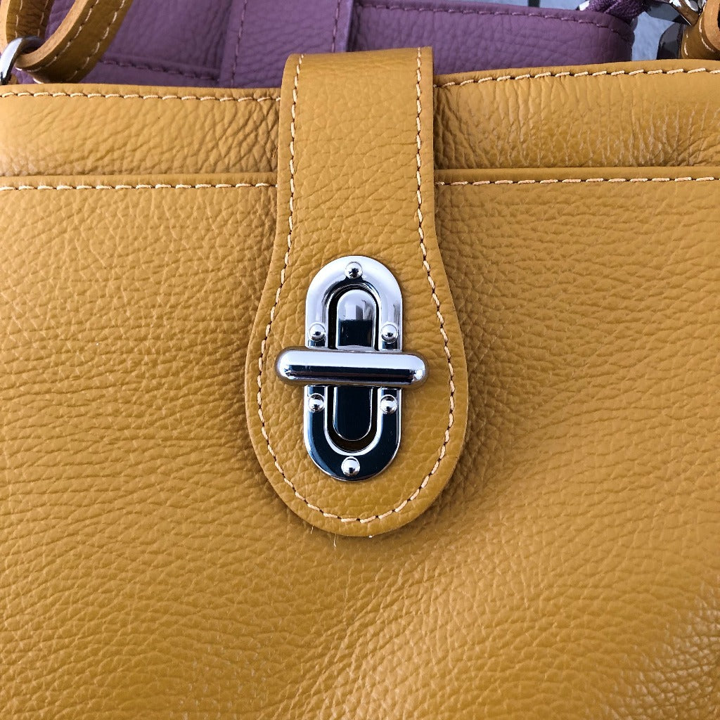Close up view of the Verona bag in mustard